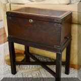 F16. Antique chest on stand. 22”h x 17”w x 10”d 